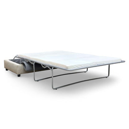 The stool fully converted into a double bed, showing the mattress and sleeping area.