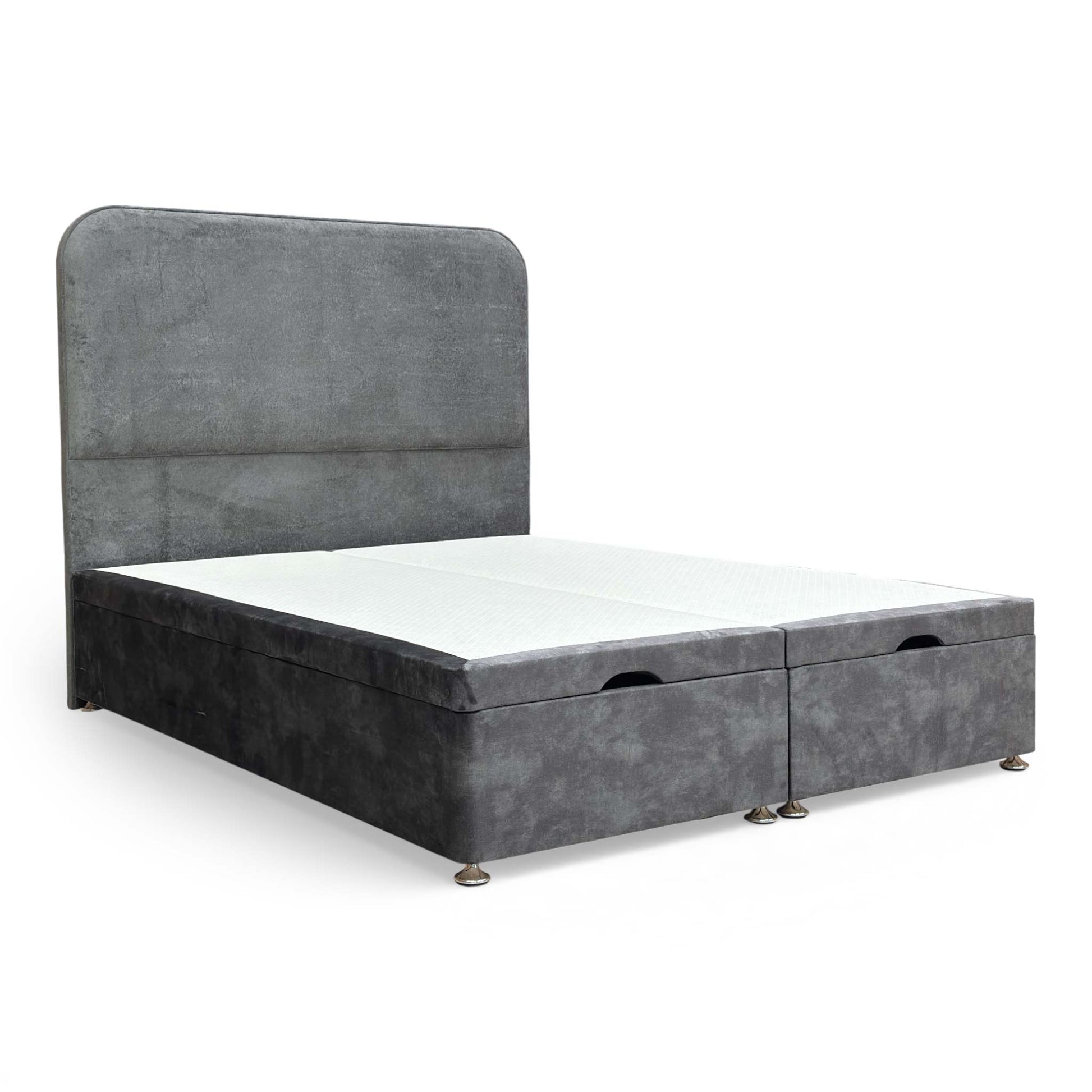 Full shot of the King size Highgrove Pluto bed, showing the dark Domino velvet floor-standing headboard and matching ottoman base.