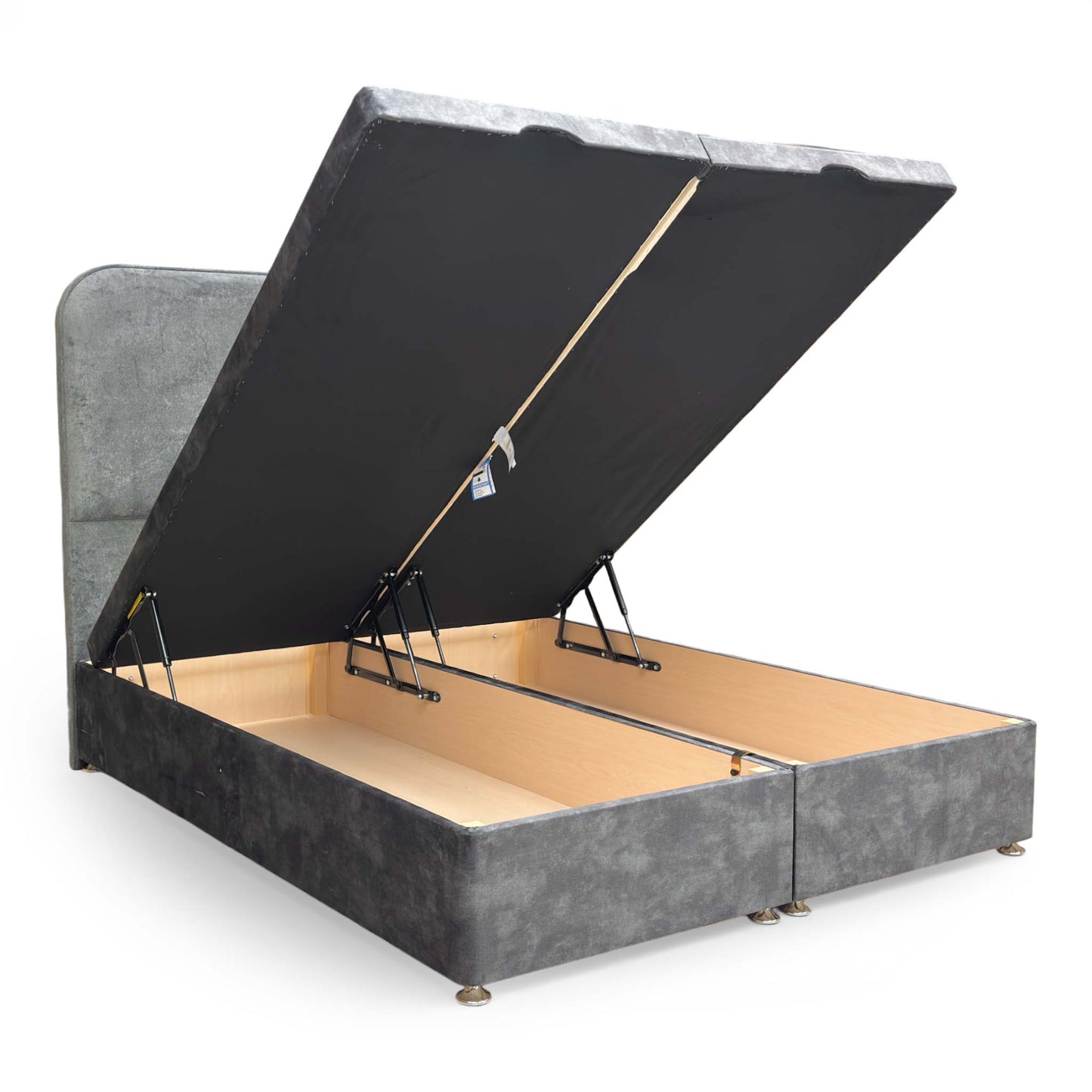 Detail shot of the velvet upholstery on the footboard and the high-quality stitching on the base corners.