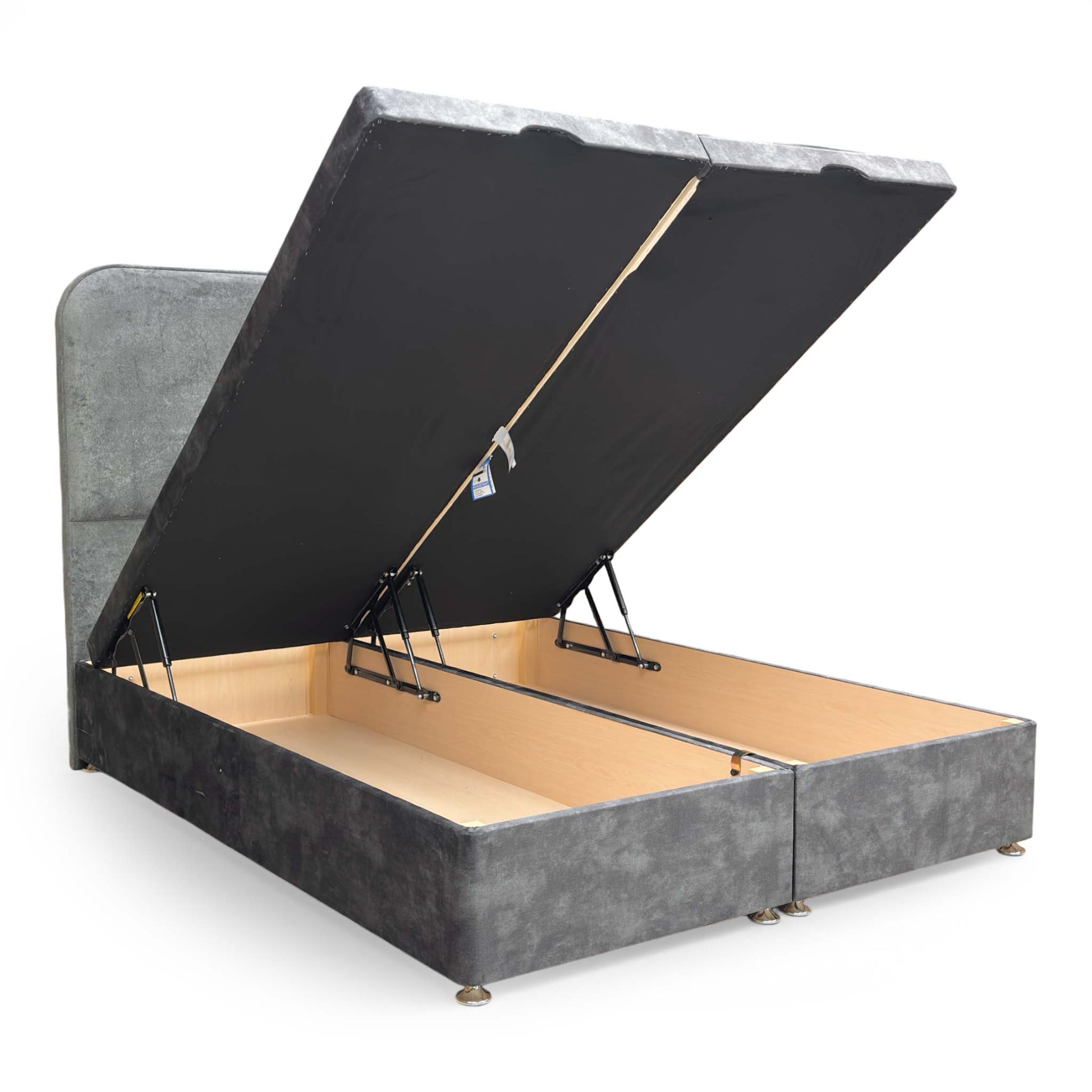 Detail shot of the velvet upholstery on the footboard and the high-quality stitching on the base corners.