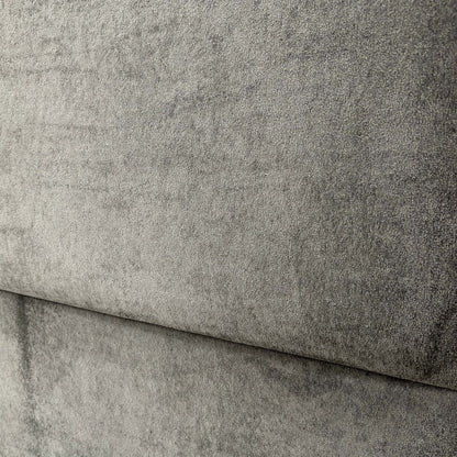 Close-up of the floor-standing headboard, emphasizing the rectangular design and the detailed texture of the Domino velvet fabric.