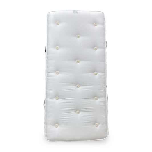 Full view of the Sleep Story ‘Natural Comfort’ single mattress, showcasing its soft white quilted cover.