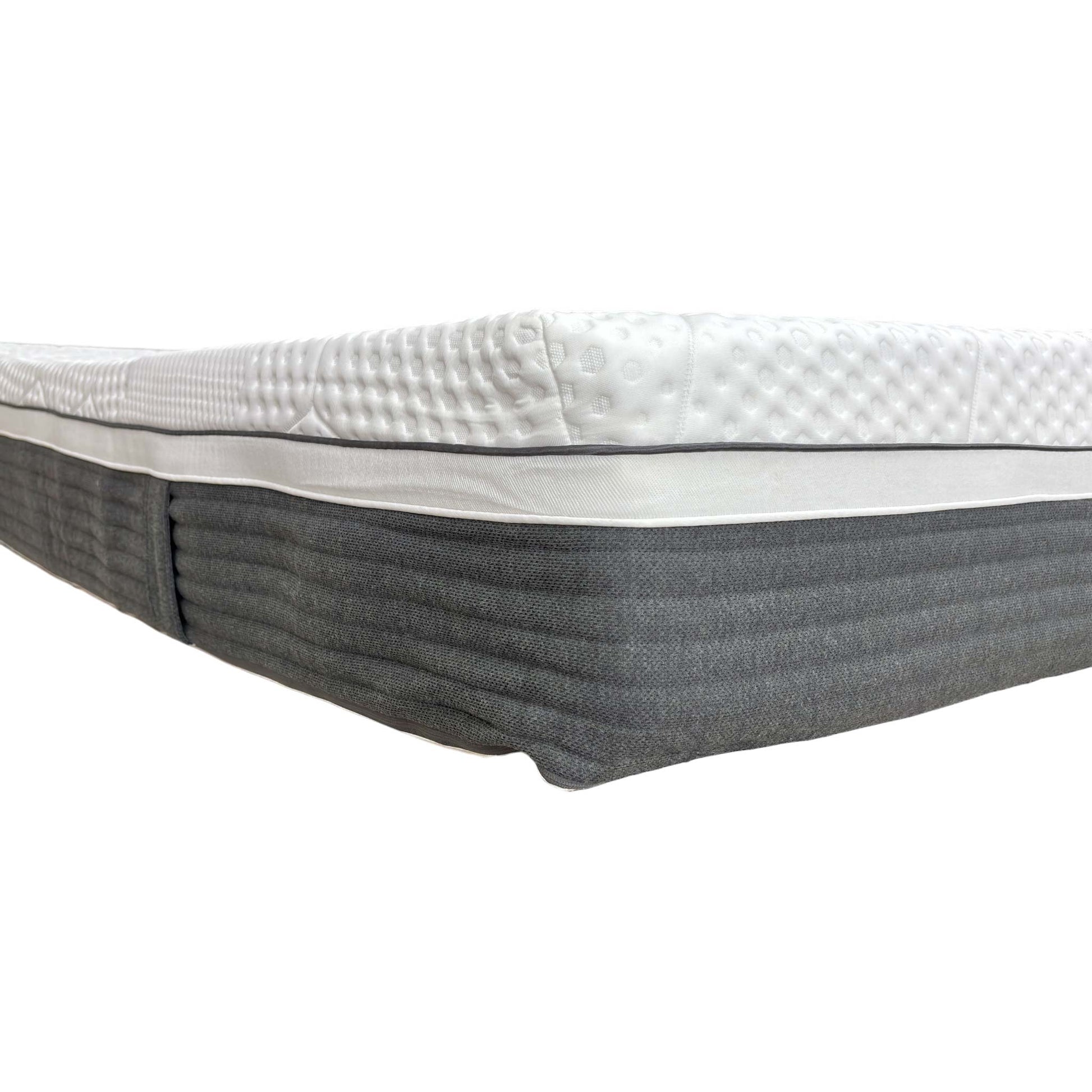 Corner detail of the mattress, illustrating the reinforced edge support and layered construction.