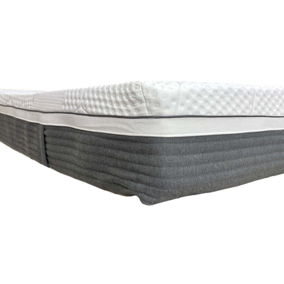 Corner detail of the mattress, illustrating the reinforced edge support and layered construction.