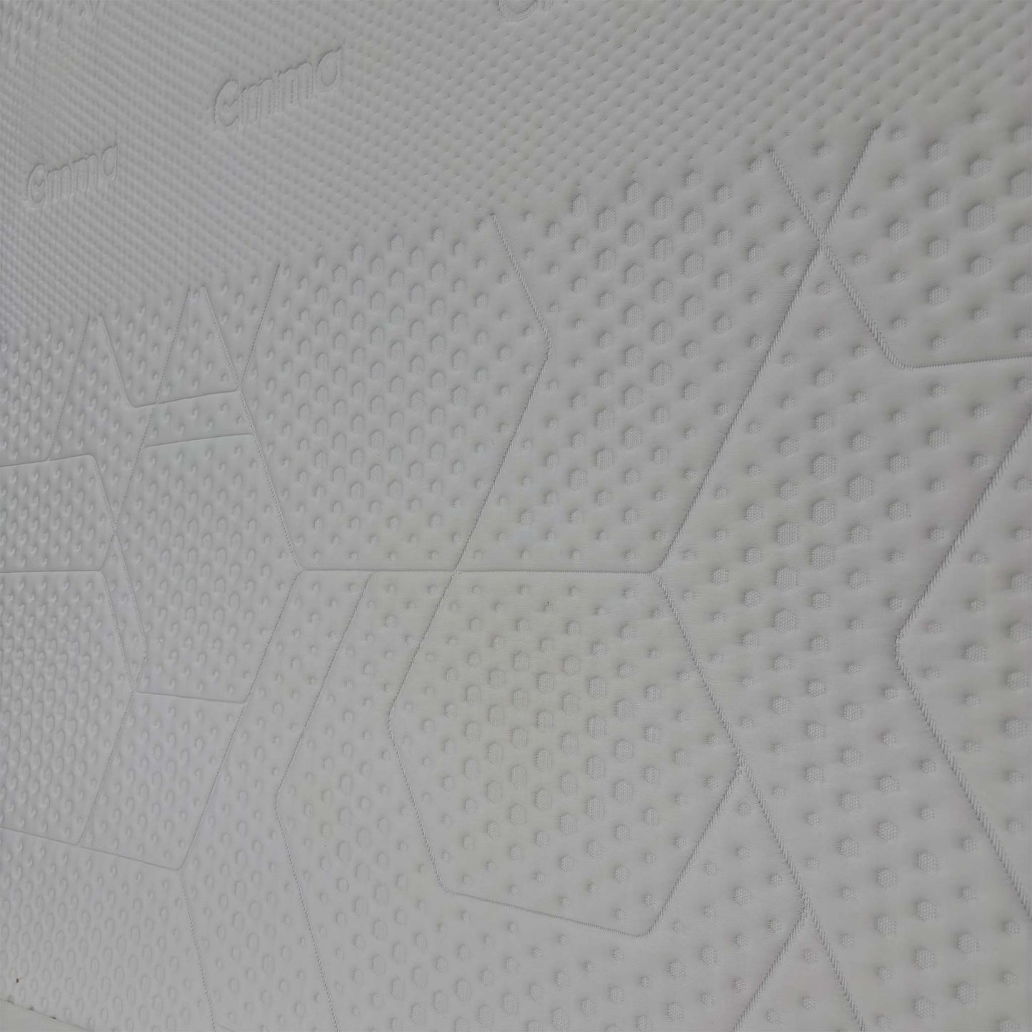 Close-up detail of the breathable mattress cover texture and high-quality stitching.