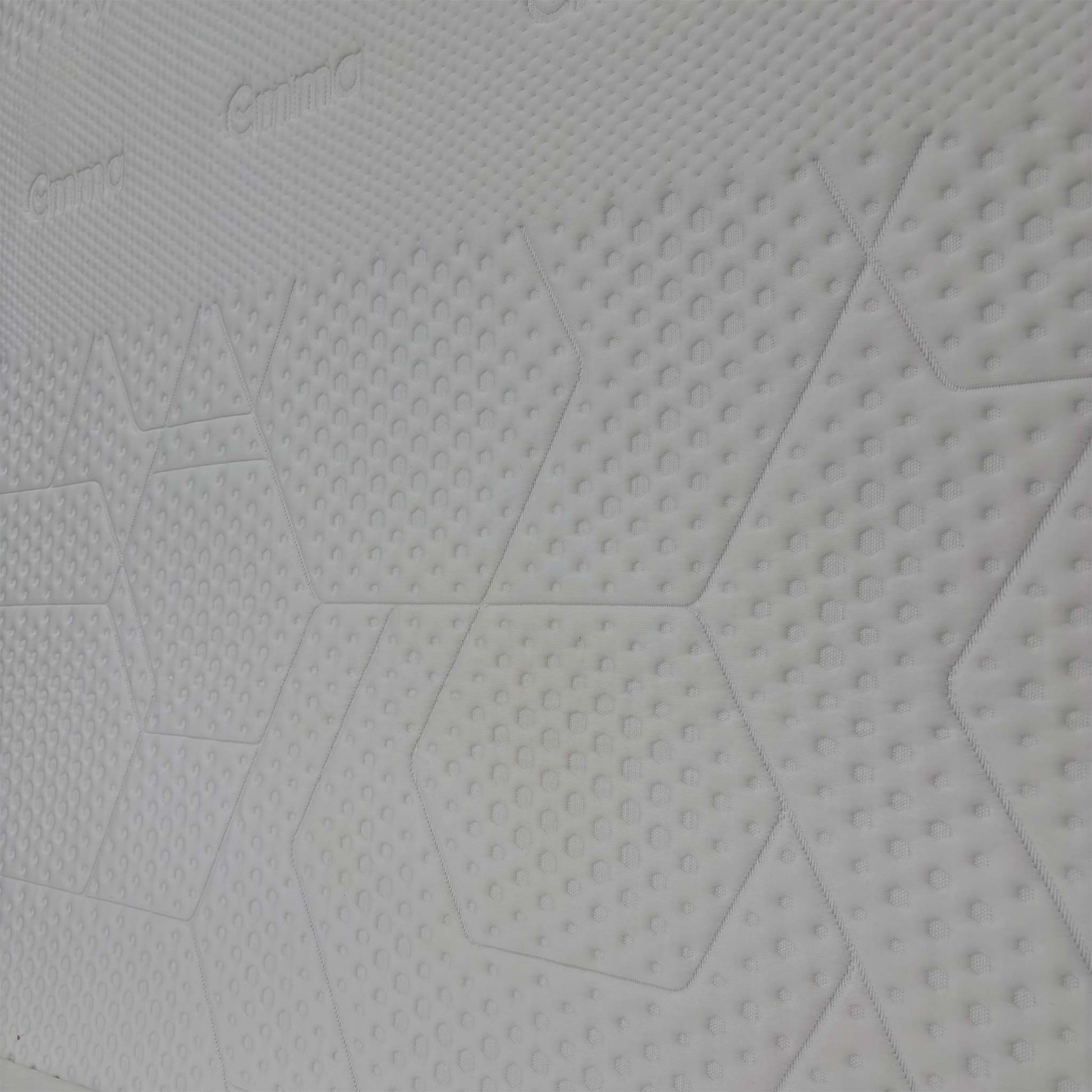 Close-up detail of the breathable mattress cover texture and high-quality stitching.