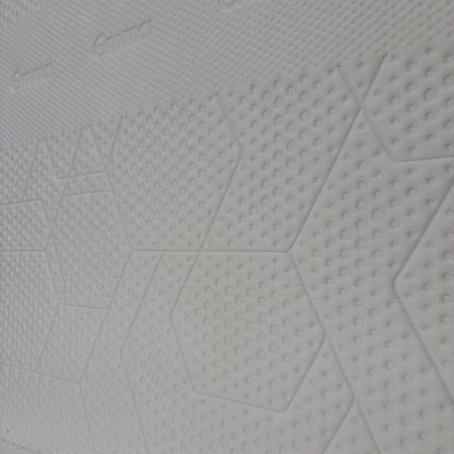 Close-up detail of the breathable mattress cover texture and high-quality stitching.