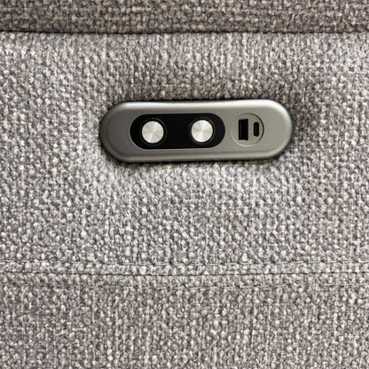Detailed shot of the integrated USB charging port and the electric recliner control buttons.