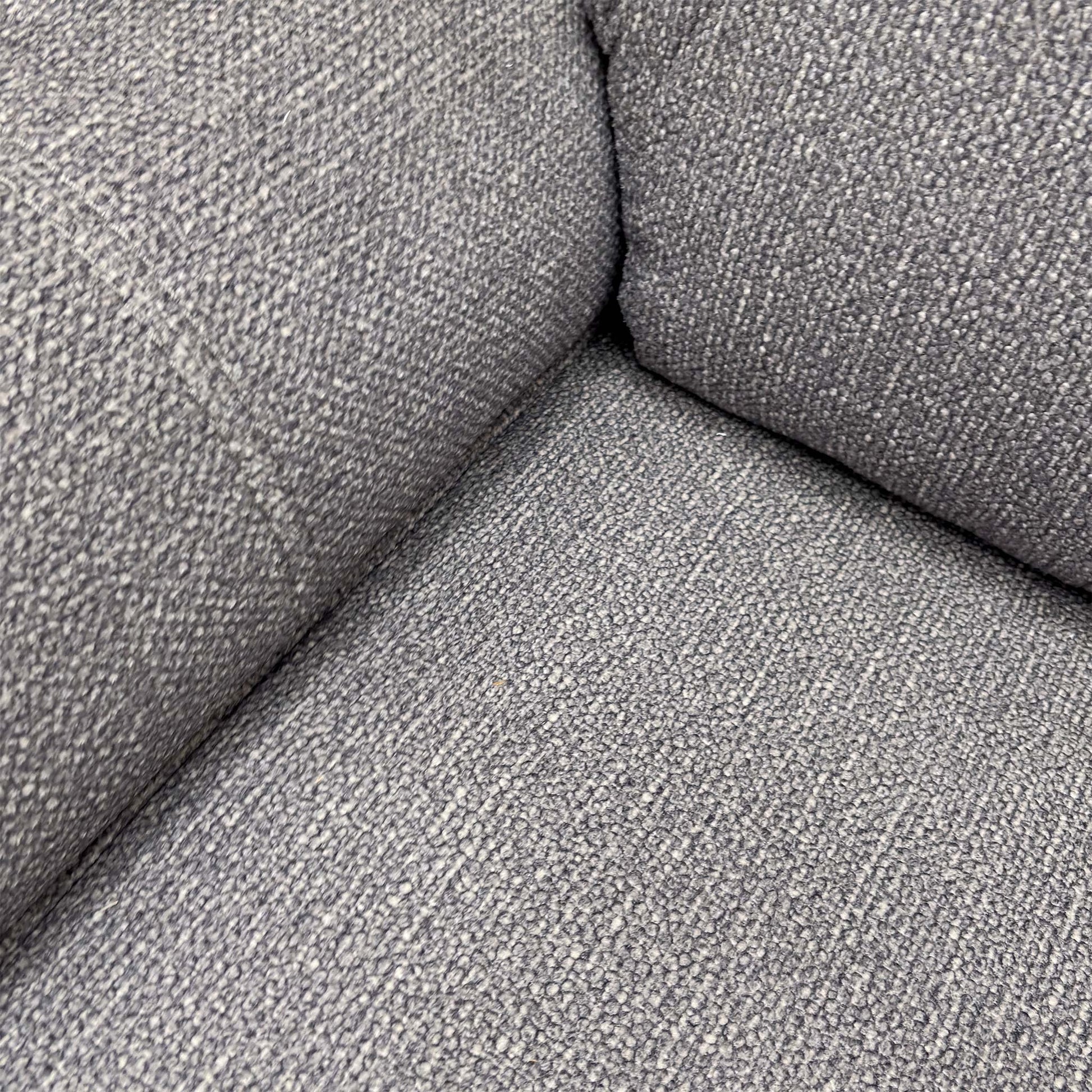 Close-up of the grey woven fabric texture, showcasing the soft and durable weave.