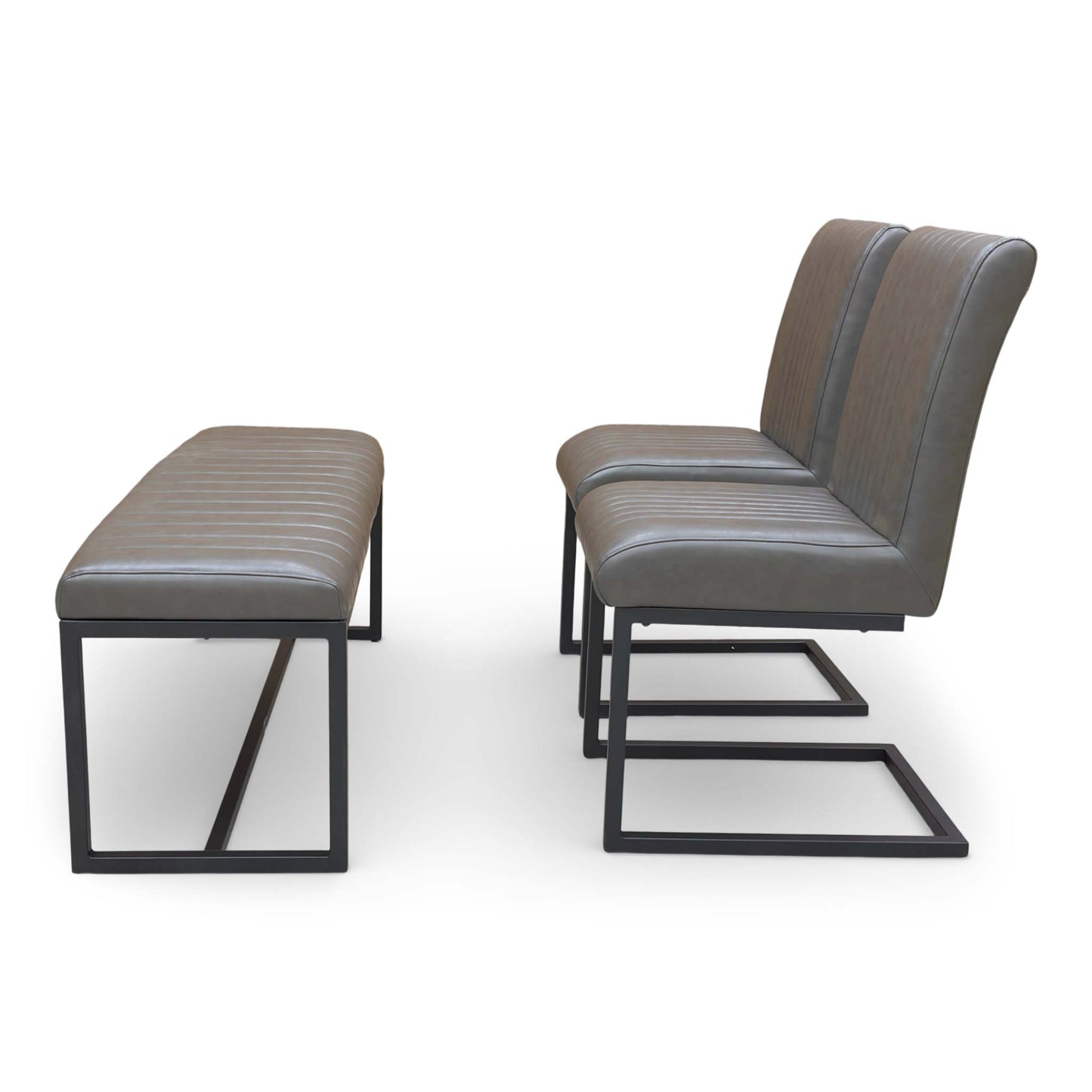 Side view of the dining chair, showing the ergonomic curve of the backrest and faux leather finish.