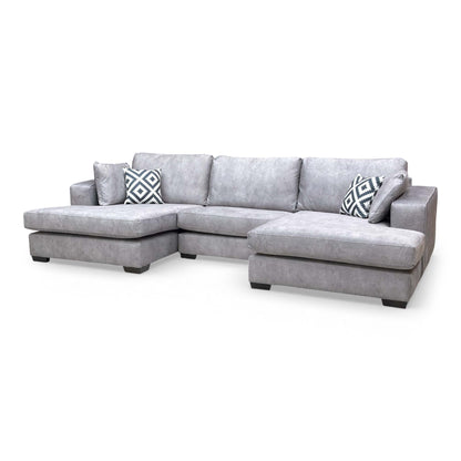 Angled view showing the symmetry of the double chaise configuration and seating area.