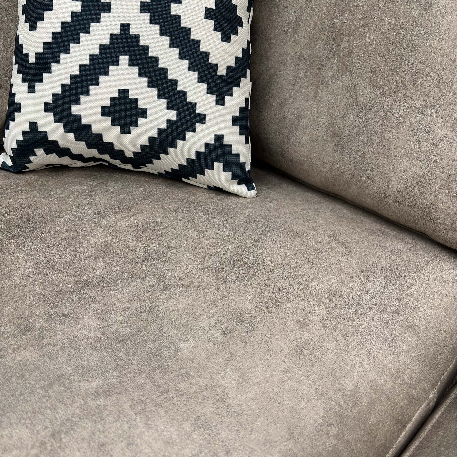 Close-up of the pearl grey velvet upholstery, highlighting the soft texture and subtle sheen of the infinity fabric.