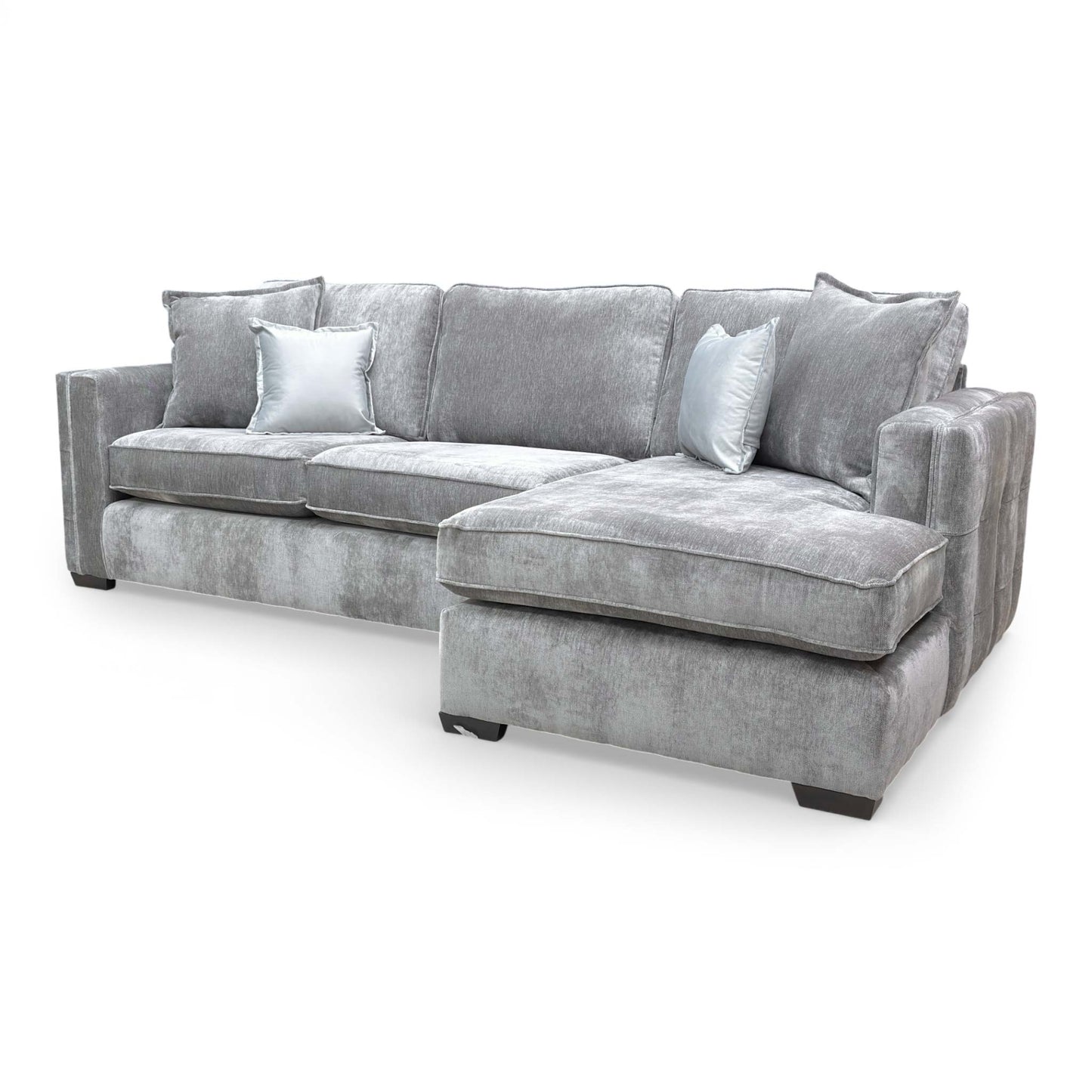 Side view of the corner sofa, showing the sleek profile and contemporary build.