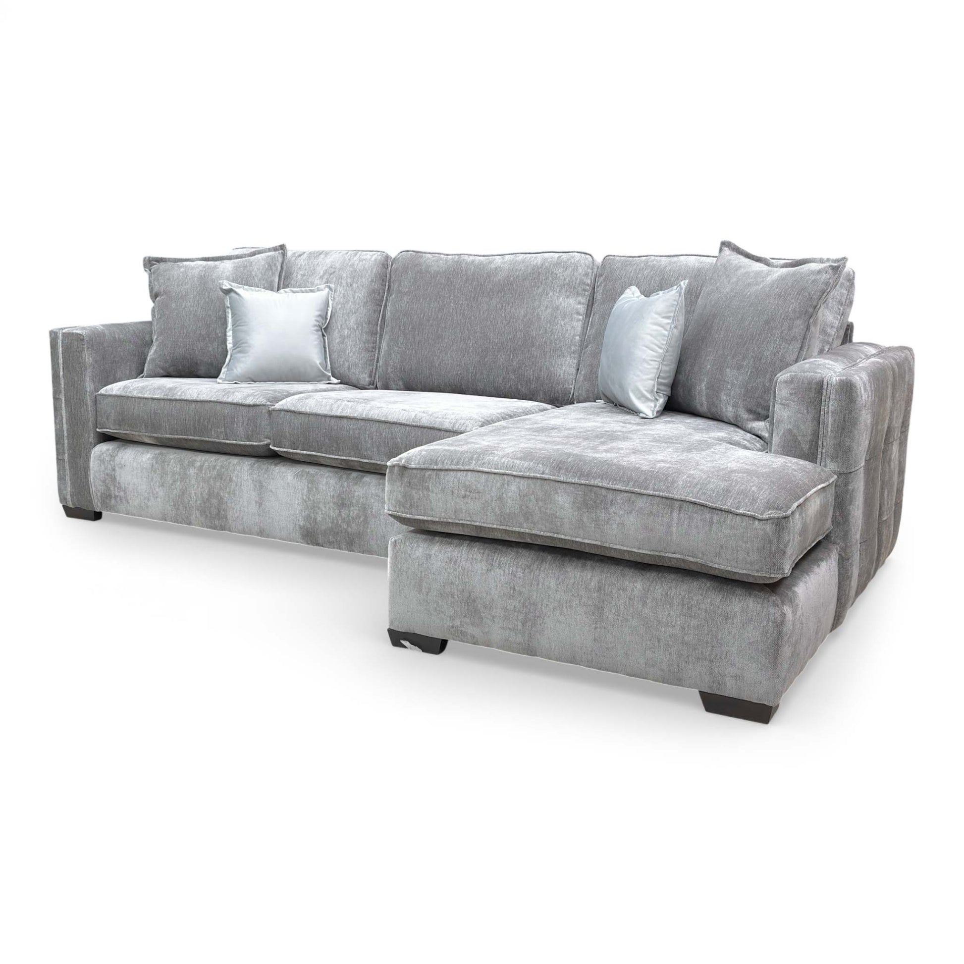 Side view of the corner sofa, showing the sleek profile and contemporary build.