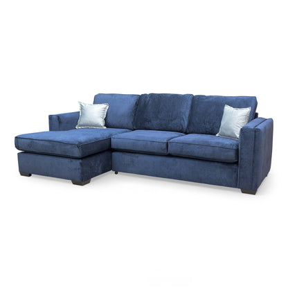 Wide-angle shot of the 'Chelsea' large left-hand facing corner chaise sofa in navy blue Kingston fabric.