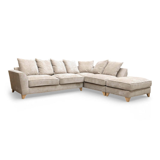 Full front view of the 'Legend' right-hand facing corner sofa in Kingston Beige fabric, showcasing its large pillow back cushions.