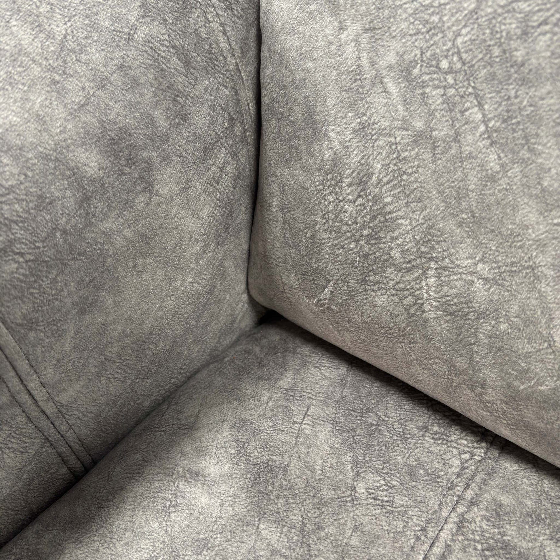 Close-up of the Marble Stone dapple velvet fabric, highlighting the soft texture and detailed stitching on the seat.