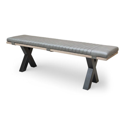 Side view of the bench, highlighting the black metal X-shaped legs and the thickness of the oak top.