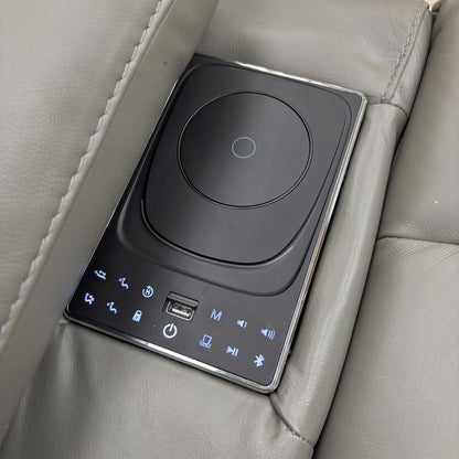 Close-up of the media arm on the 3-seater sofa, showing the Bluetooth control panel and integrated speakers.