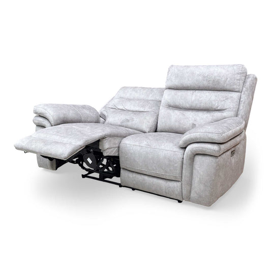 Side perspective view of the sofa showing the double-padded armrests and high back support.
