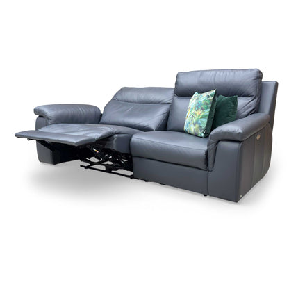 Side view of the sofa emphasizing the high backrest and padded arm design.