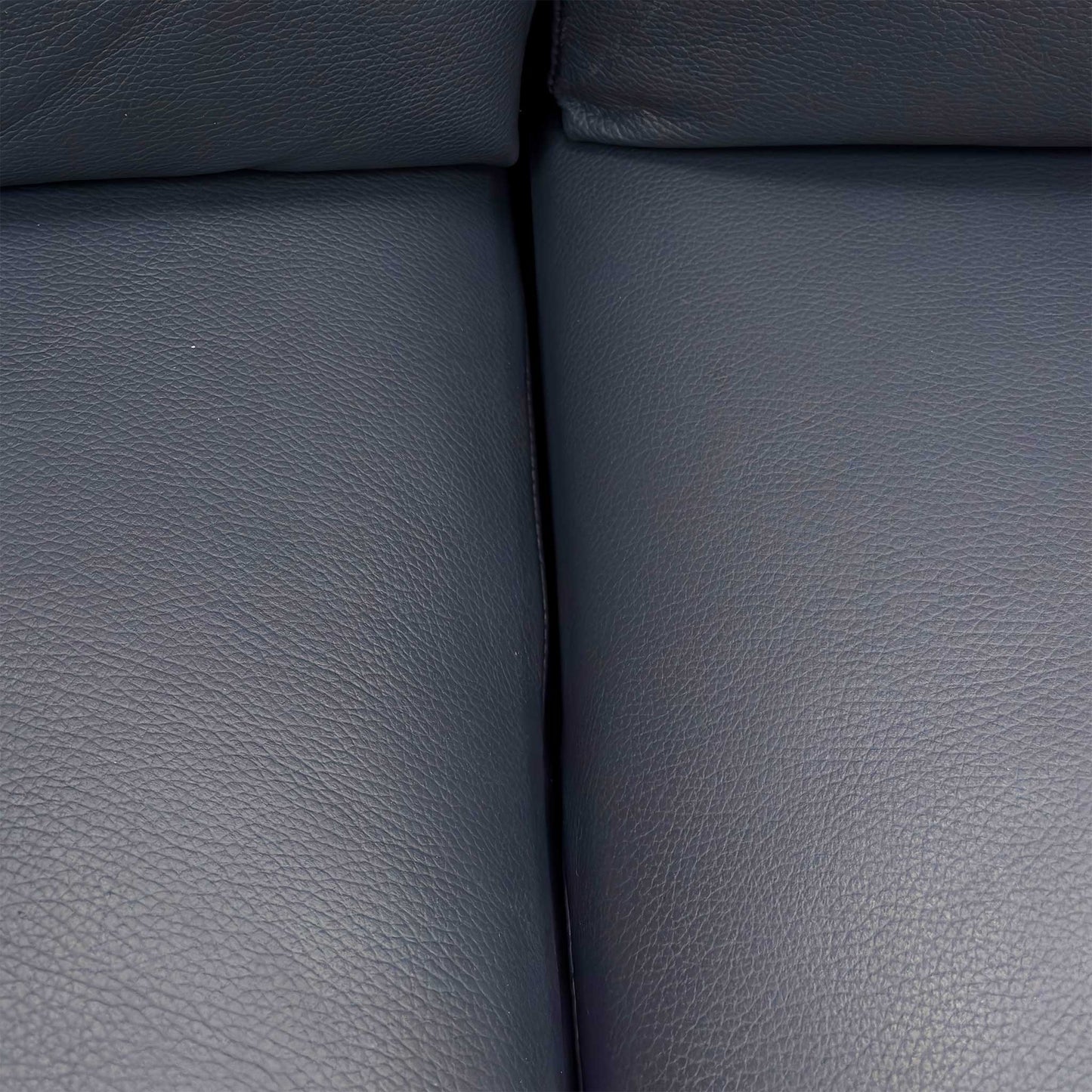 Close-up of the stitching details and the medium-firm foam seat cushions.