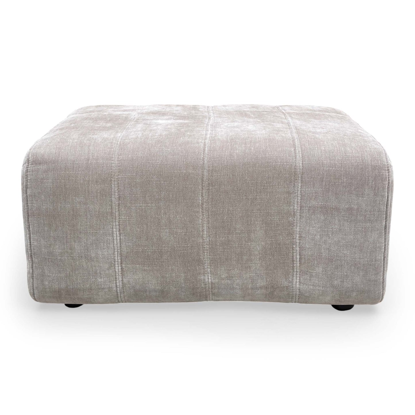 Top-down view of the footstool, showcasing the generous foam-cushioned surface.