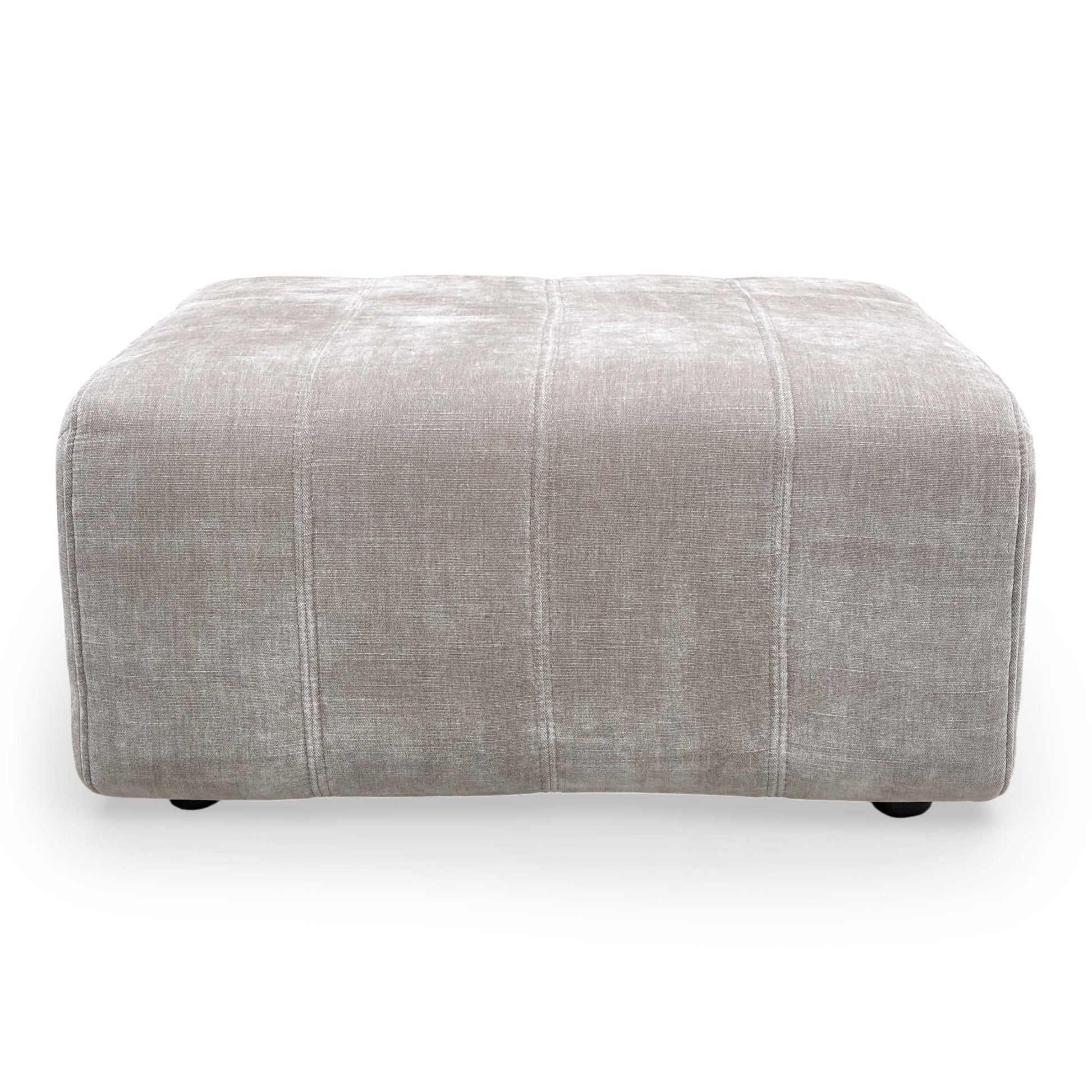 Top-down view of the footstool, showcasing the generous foam-cushioned surface.