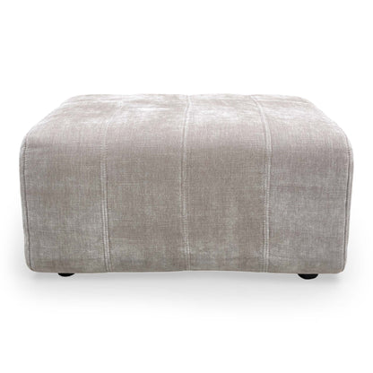 Top-down view of the footstool, showcasing the generous foam-cushioned surface.