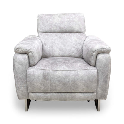 Front view of the Elphaba Cotton White leather armchair with its signature wide storage arms.