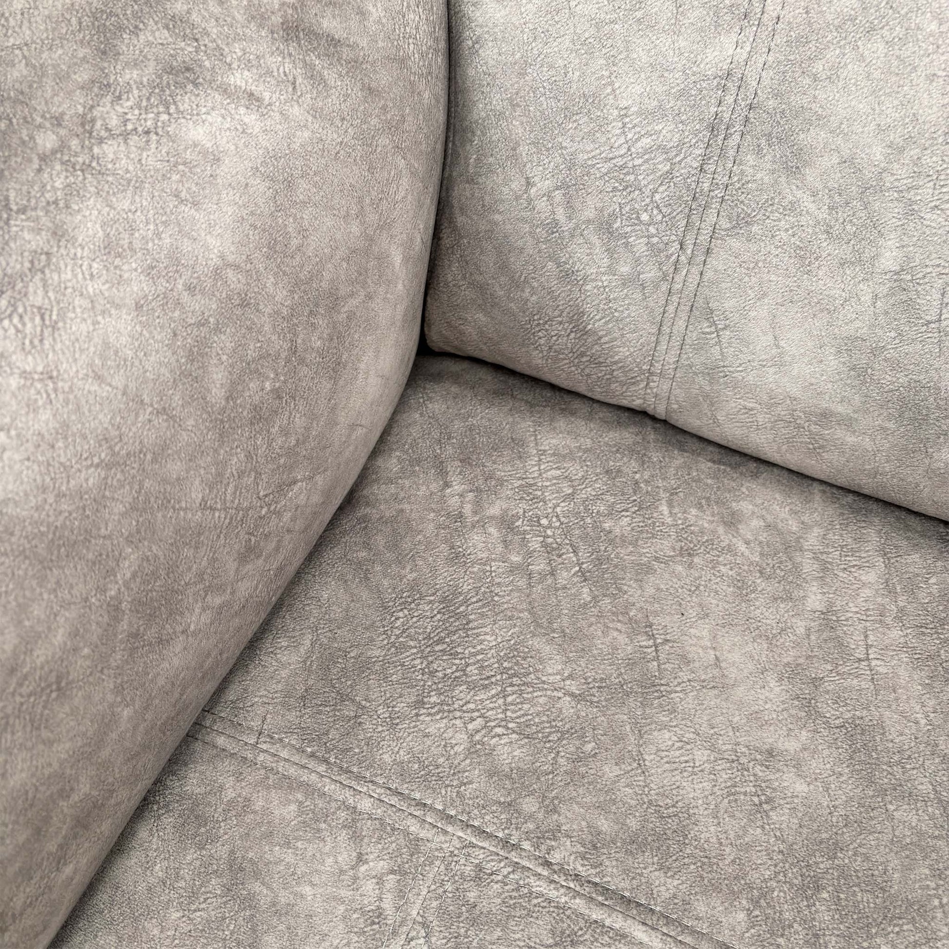 Close-up of the manual adjustable headrest in an elevated position for neck support.