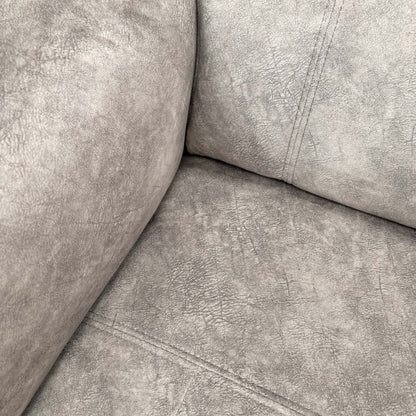 Close-up of the manual adjustable headrest in an elevated position for neck support.