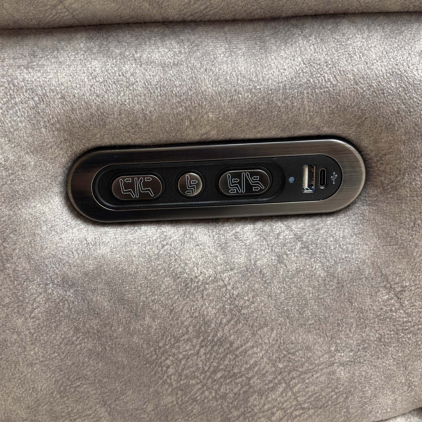 View of the side control buttons for the independent power recline and footrest functions.