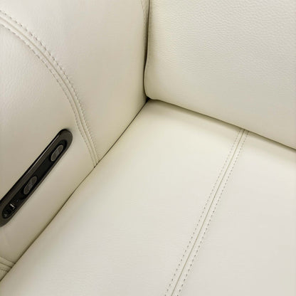 Close-up of the pull-out storage compartment inside the armrest, showcasing hidden storage.