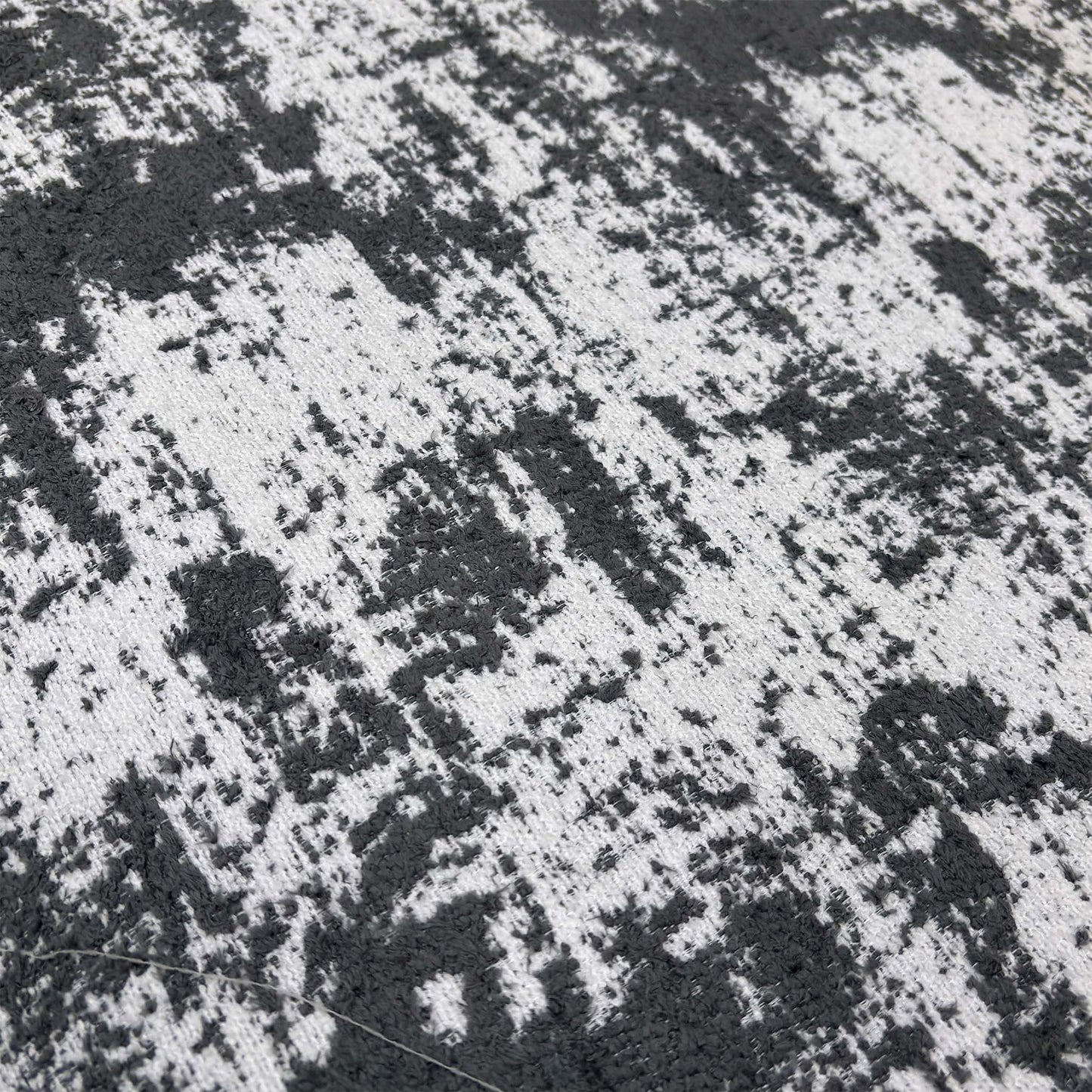 Close-up of the plush Kai Grey chenille fabric, emphasizing the soft texture and high-quality weave of the upholstery.