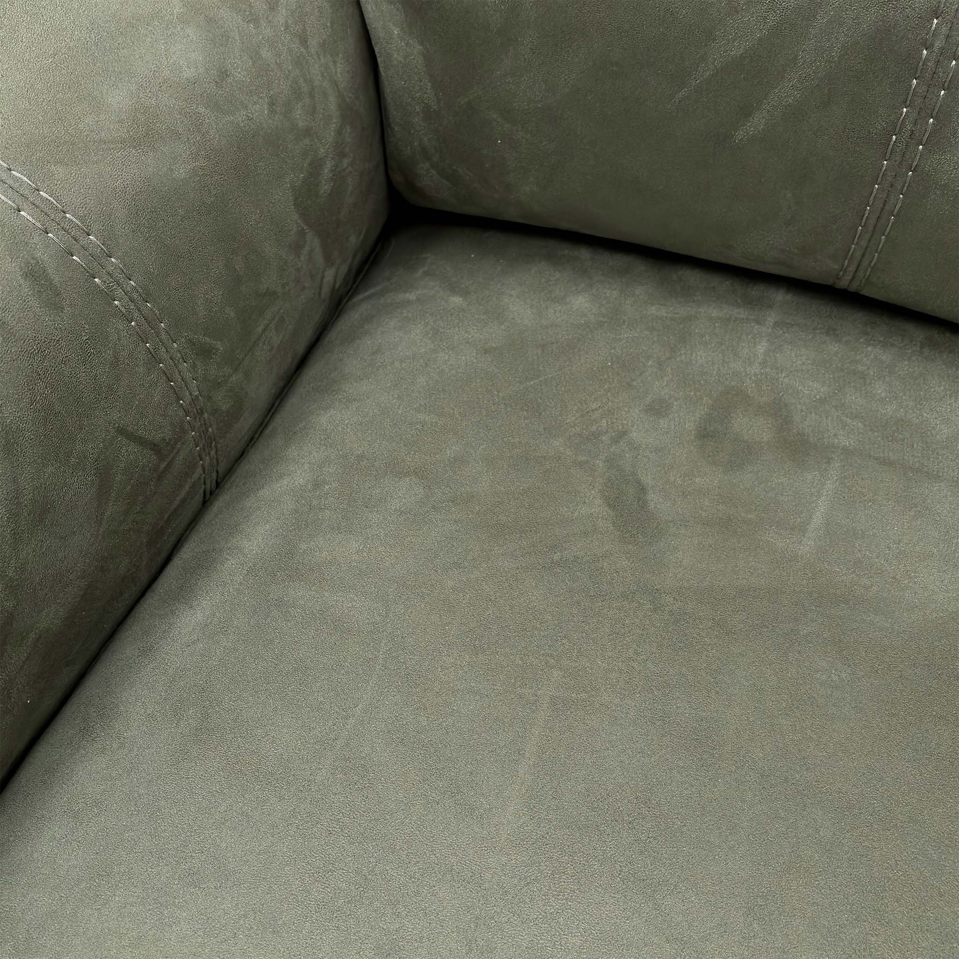 Close-up profile of the corner sofa highlighting the high-back design and plush headrest cushioning.