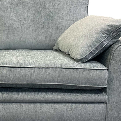 Side profile of the ‘Chalfont’ sofa showcasing the sleek silhouette and wooden frame base.
