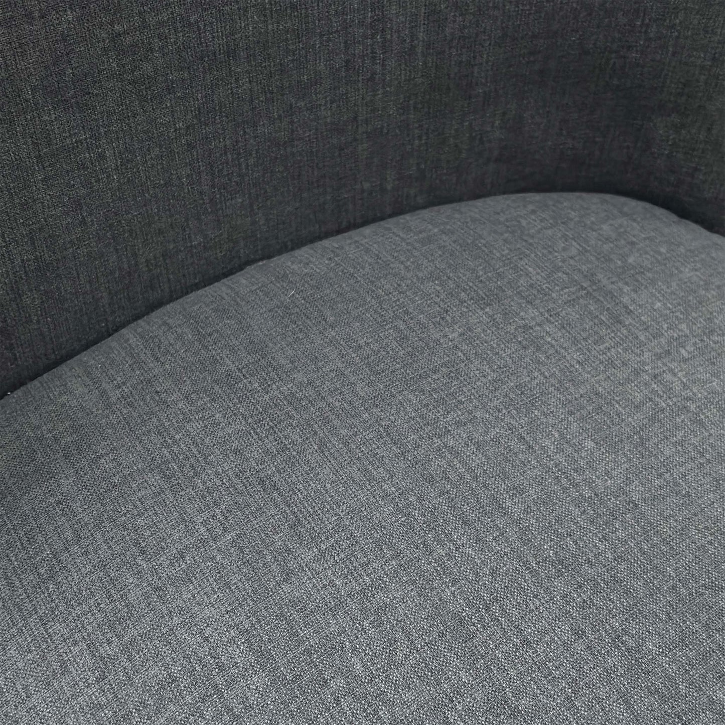 Close-up of the durable charcoal grey fabric upholstery on the Hamilton dining chair.