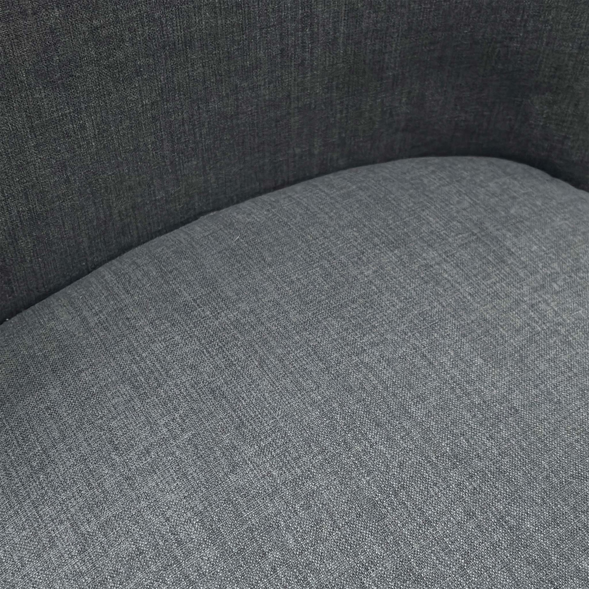 Close-up of the durable charcoal grey fabric upholstery on the Hamilton dining chair.