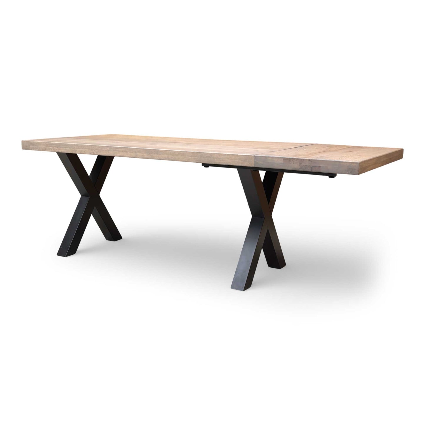 Industrial-style grey oak dining table with rustic wood finish and X-frame metal base.