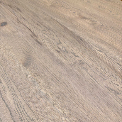 Close-up of vintage grey solid oak tabletop showing natural wood grain, knots, and texture.