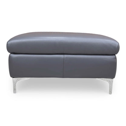 Front view for the ‘Vino’ footstool in Cat 60 18 Lavender Grey premium leather, featuring a sleek rectangular design and plush cushioning.