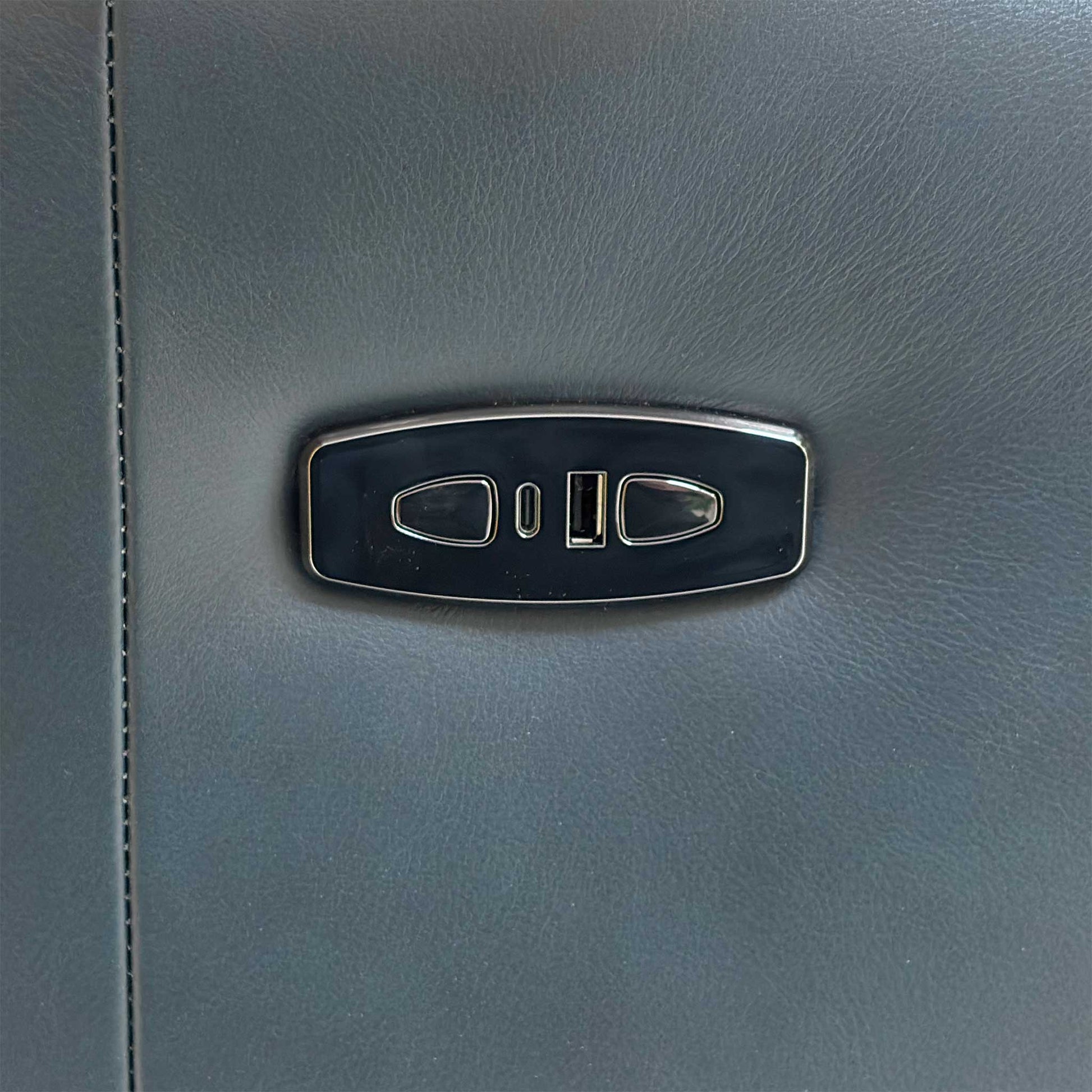 Close-up of the side power controls and USB charging port, allowing for easy adjustment and device connectivity.