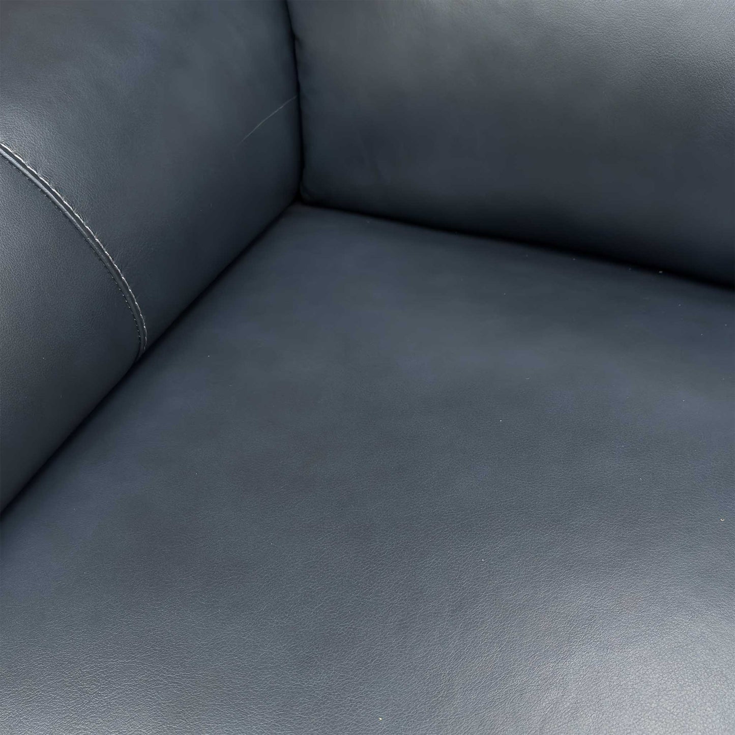 Detailed texture shot of the Natural Milled Navy leather, showcasing the authentic grain and high-quality finish.