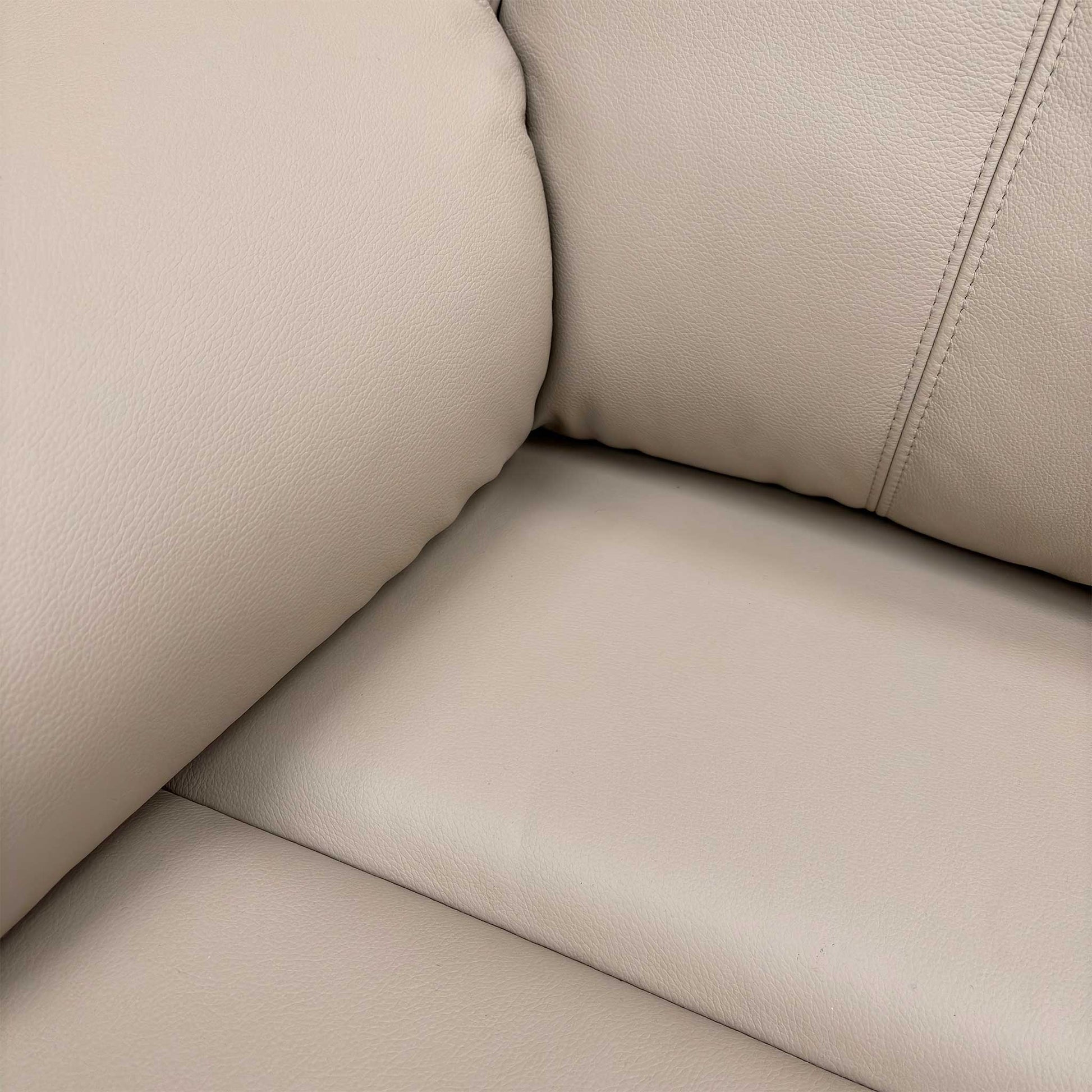 Detailed close-up of the Cambridge Plaster premium leather upholstery, emphasizing the fine grain and soft texture of the Grade L leather.
