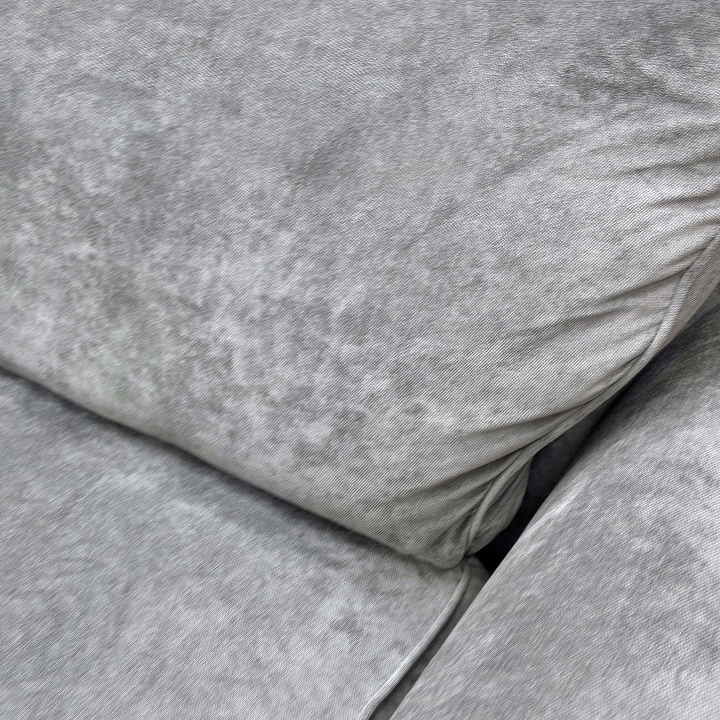 Close-up of the Kingston Grey fabric, illustrating the durable yet soft weave and neutral tone suitable for various interiors.