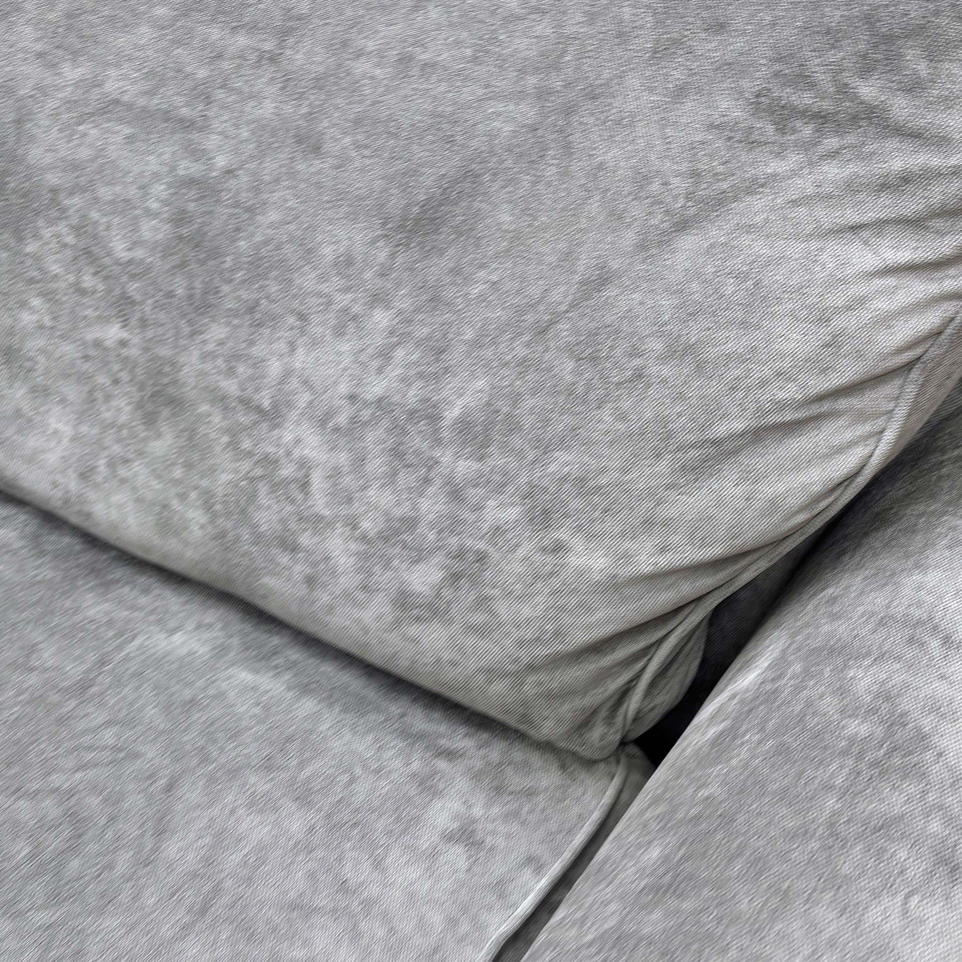 Close-up of the Kingston Grey fabric, illustrating the durable yet soft weave and neutral tone suitable for various interiors.