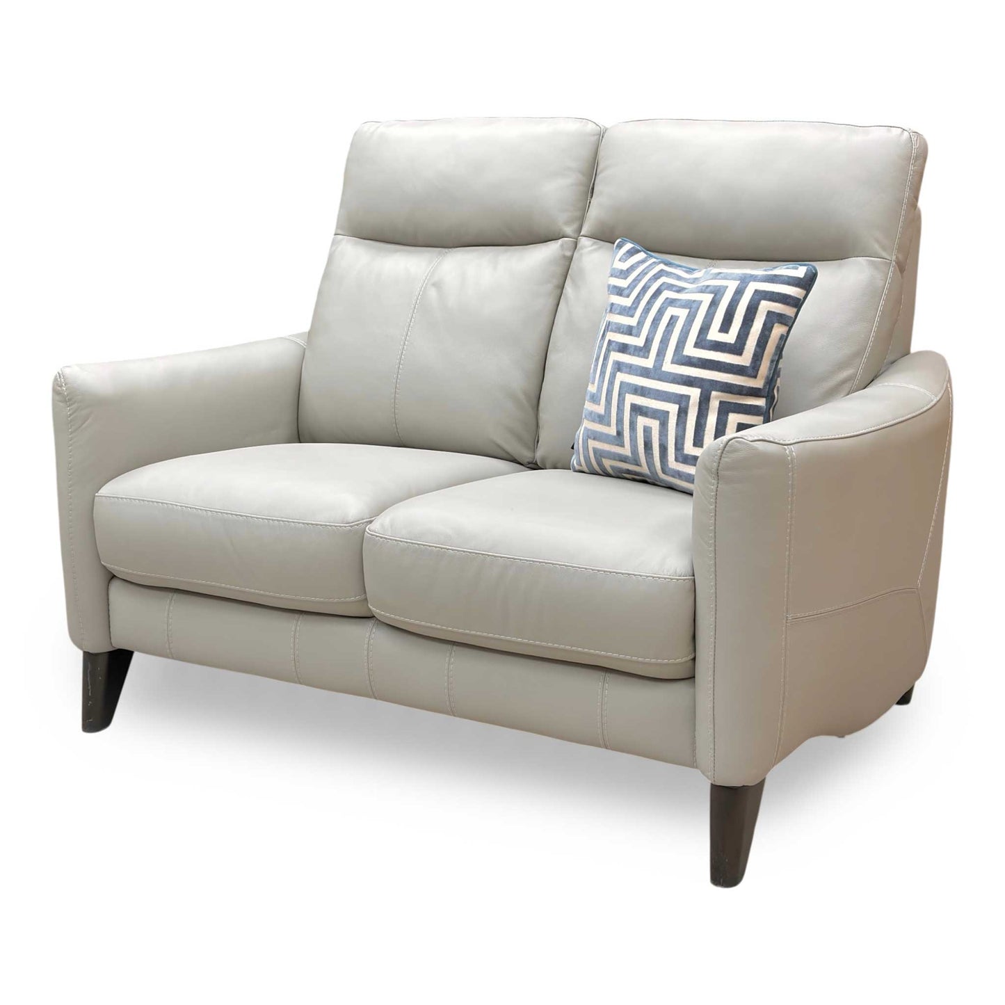 Perspective shot of the Petit sofa, showcasing the contoured high back designed for optimal lumbar and neck support.