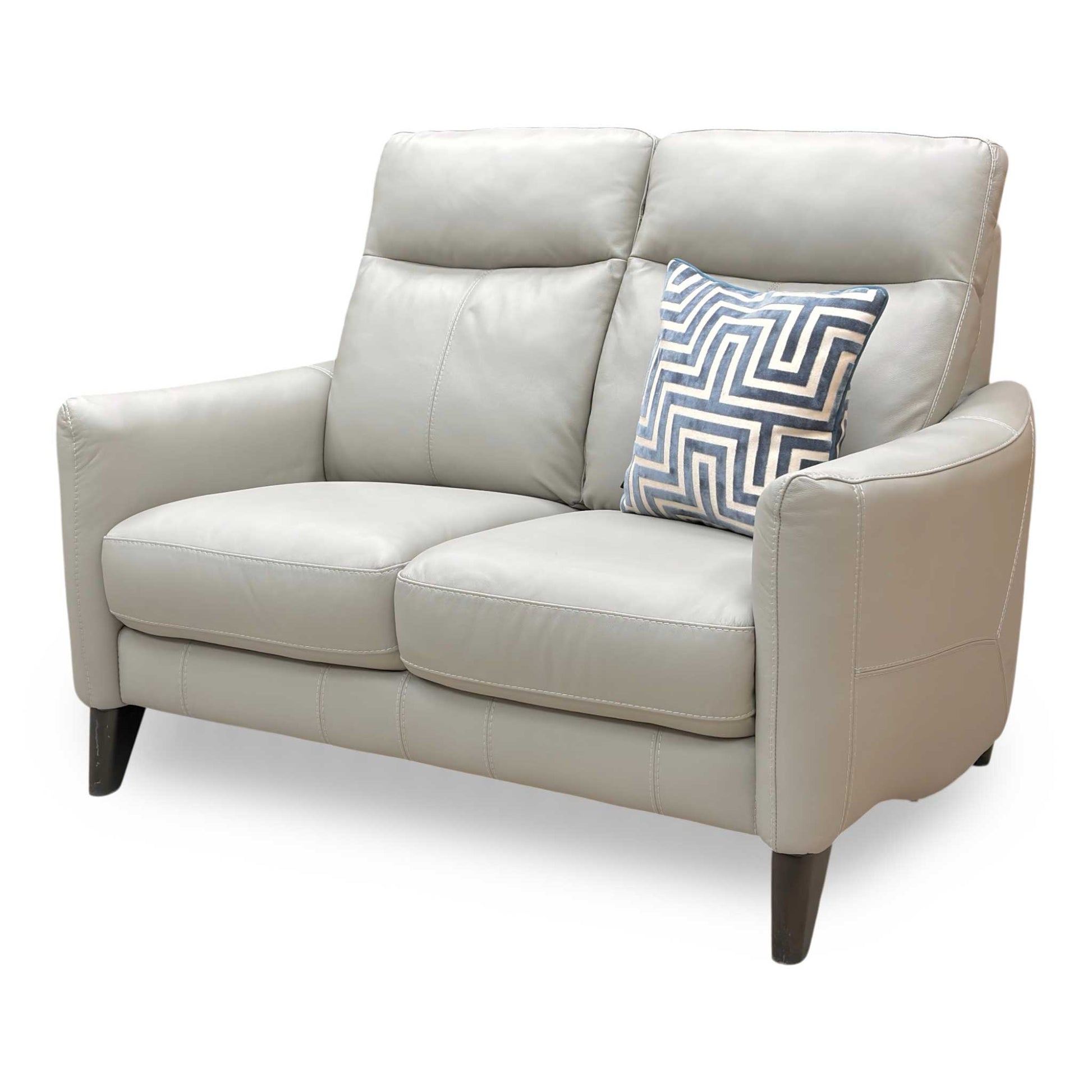 Perspective shot of the Petit sofa, showcasing the contoured high back designed for optimal lumbar and neck support.