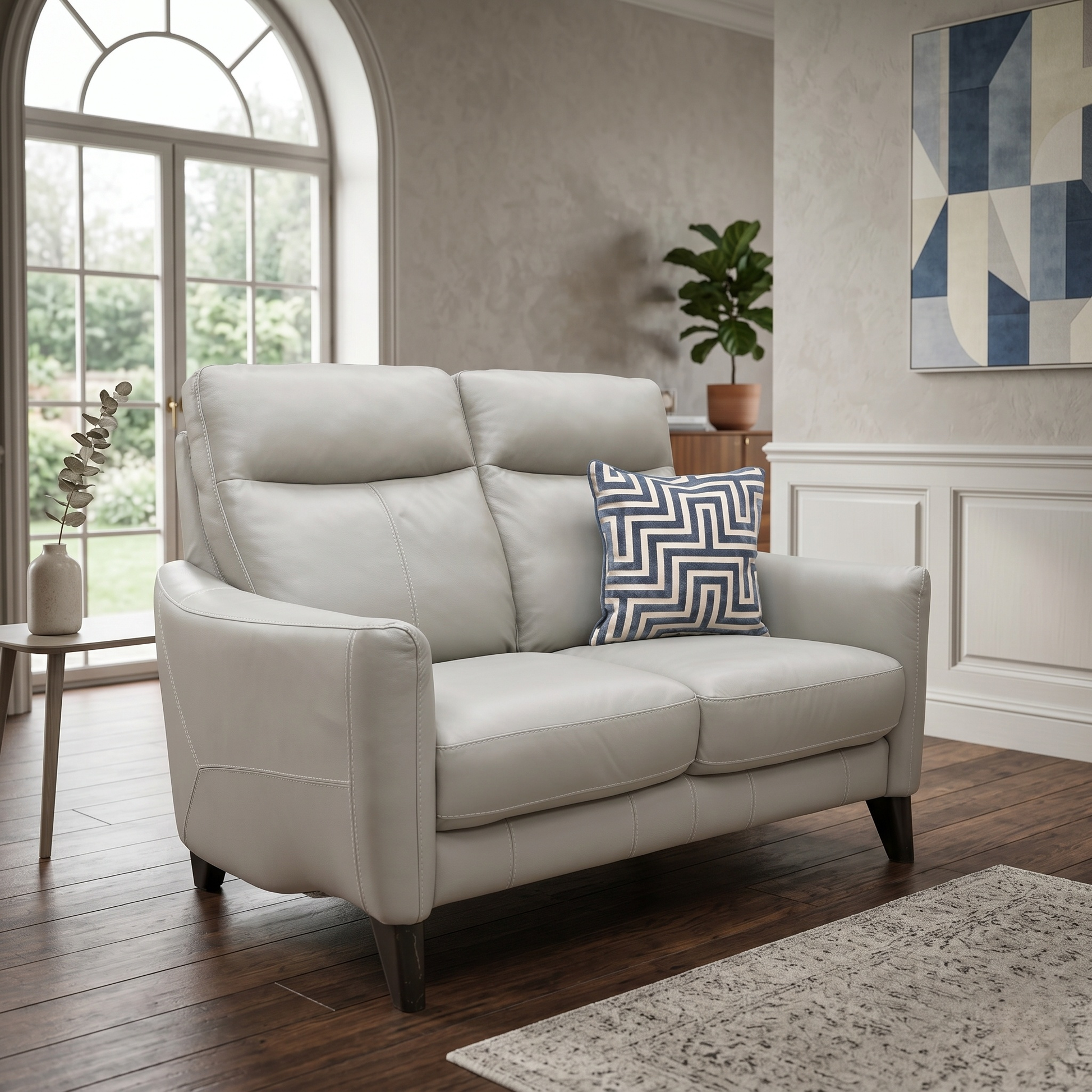 Living room of the Petit sofa, showcasing the contoured high back designed for optimal lumbar and neck support.